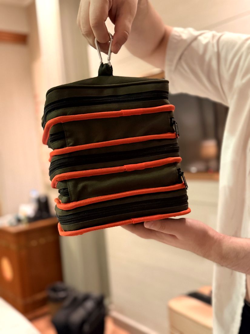 DashKit Prototype 2 travel kit held up by its carabiner hook