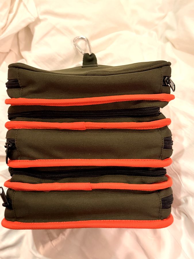 DashKit prototype closed — three stacked tiers with orange piping and black zips